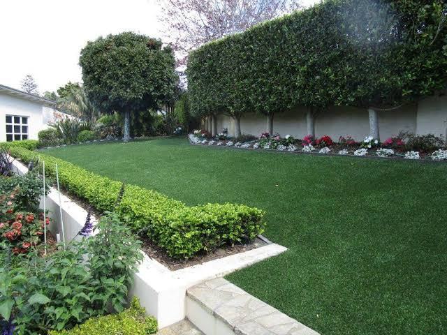 Artificial grass lawn with hedged borders in the Portland area